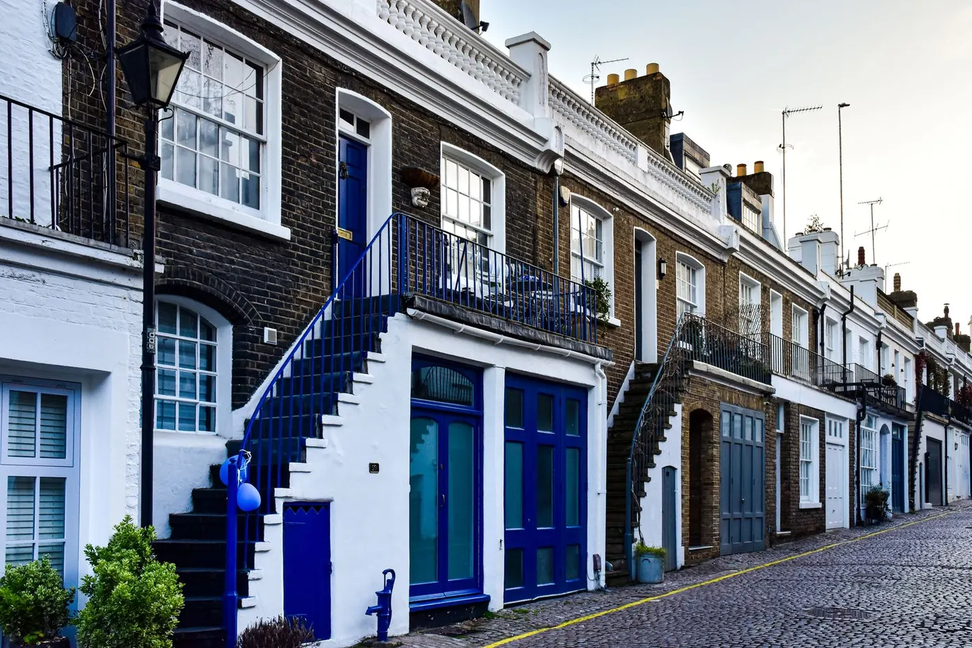 Mews houses with painted doors and outside stairs