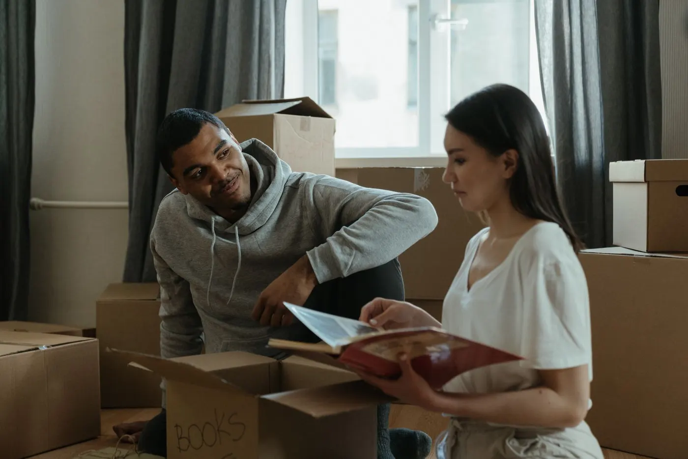 Tenants unpacking boxes in a new flat