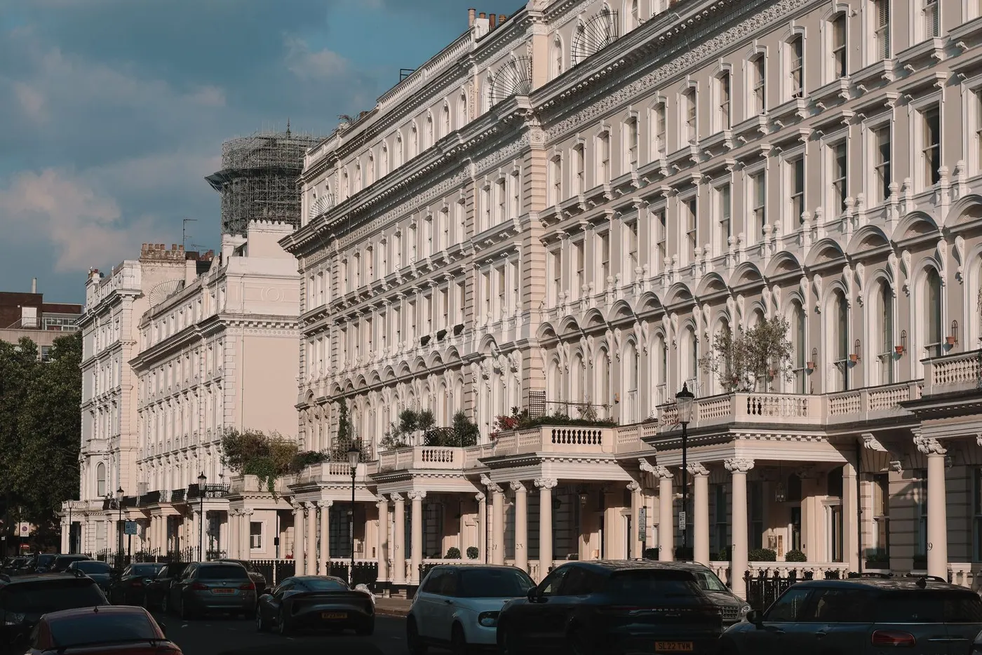 A long terrace of white stucco townhouses